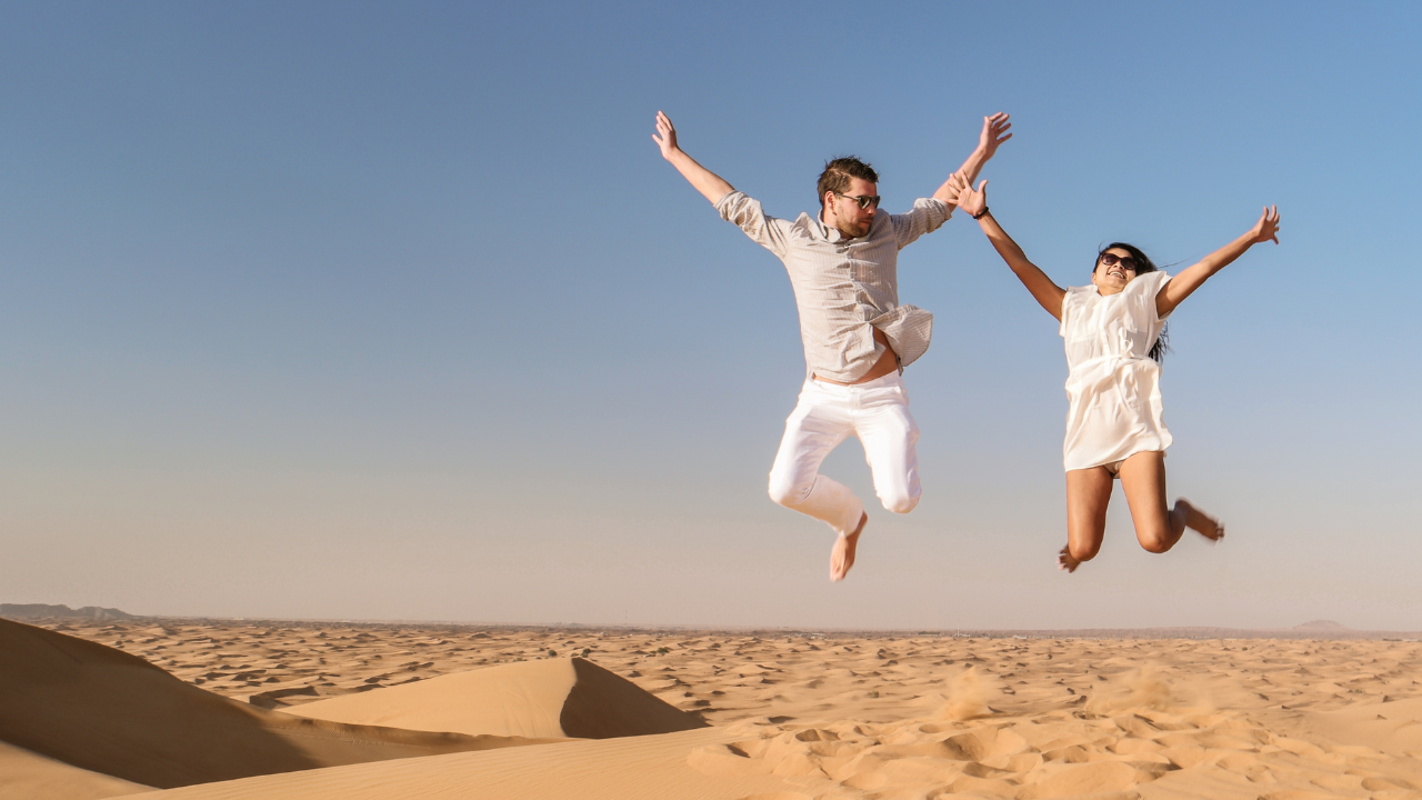 The serene Dubai desert with golden sands stretching into the horizon offering a glimpse of the natural beauty and cultural heritage